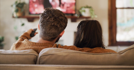 Back, relax and watching TV with couple on sofa in living room of home for video streaming....