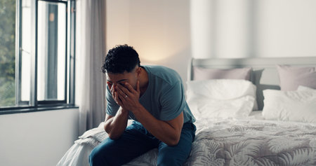 Frustrated man, tired or bed with stress for insomnia, sleep apnea or deprivation in home. Male...