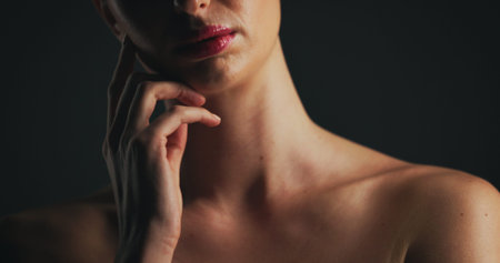 Shoulder, glow and hand of woman in studio for dermatology, body care and hygiene. Collagen...