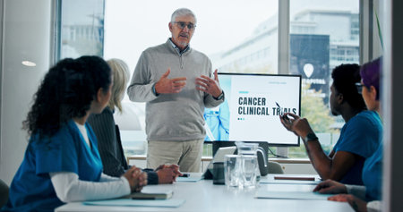 Man, meeting and presentation with medical team for cancer awareness, clinical trial or workshop....