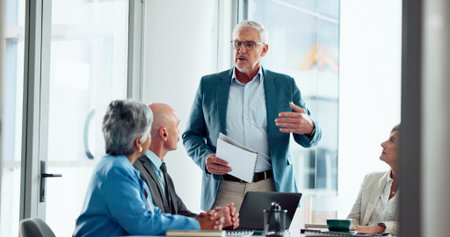 Businessman, meeting and discussion with team for presentation or corporate strategy in office. Man,...