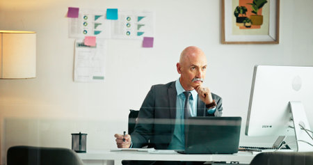 Business, thinking and man in office, computer and investment with problem solving. Mature person,...