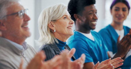 Applause, board meeting and doctors in hospital with healthcare funding opportunity. Clapping hands,...