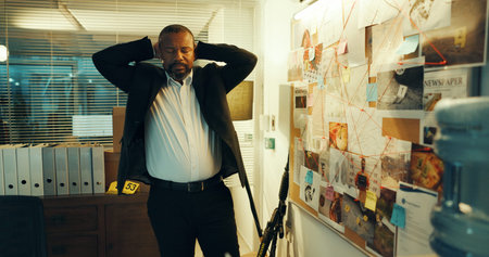 Black man, detective and stress with evidence board for investigation, crime scene and clue mapping....