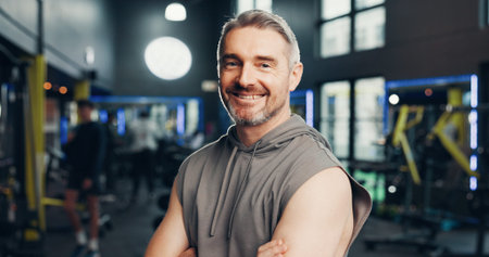 Fitness, man or arms crossed with portrait at gym for bodybuilding, health training or about us....