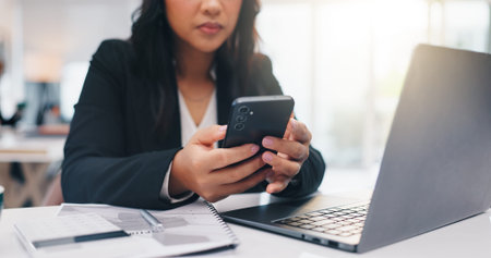 Business, cellphone and woman in workplace, laptop and financial agency with stock market. Person,...