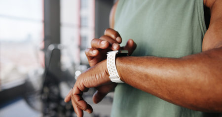 Smart watch, fitness and hands of man in gym for tracking exercise, training and workout progress....