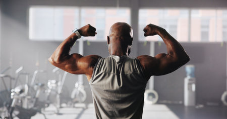 Muscles, flex and back of man in gym for bodybuilding training, exercise and strength workout....