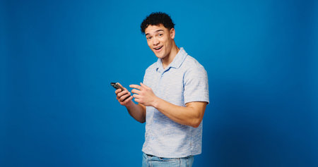 Surprised, phone and portrait with man in studio for lottery results, jackpot winner and prize....