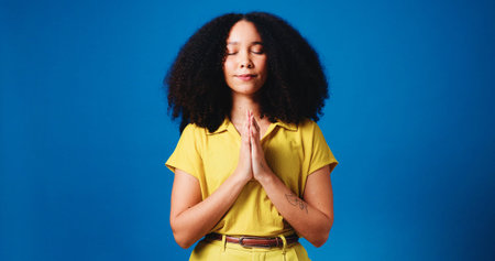 Hands, praying and woman in studio for religion, worship and praise for belief, faith and spiritual....