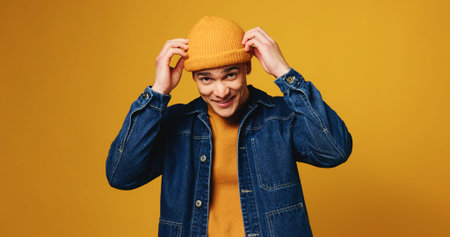 Happy, fashion and portrait of man on yellow background for trendy style, winter clothes or...