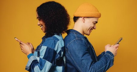Phone, happy and couple in studio with networking, communication or social media on mobile app....