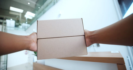 POV, hands and courier with boxes for delivery, shipping and logistics with distribution in office....
