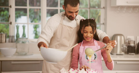 Baking, cupcakes or learning with father and daughter in kitchen of home together for pastry recipe....