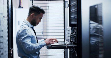 Online, cybersecurity and man with laptop, coding and check server performance and network engineer....