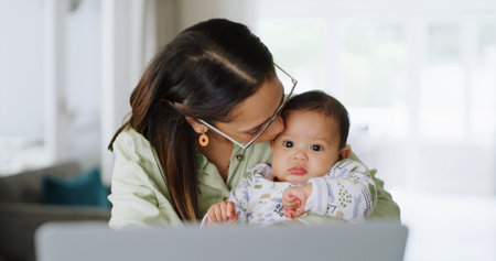 Kissing, laptop or multitasking with baby and mother in home together for small business startup....