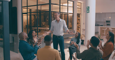 Mature man, meeting and applause in office for good news, success and winner at night. People,...
