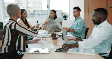 Business people, meeting and paperwork with laptop for collaboration, planning or brainstorming at...