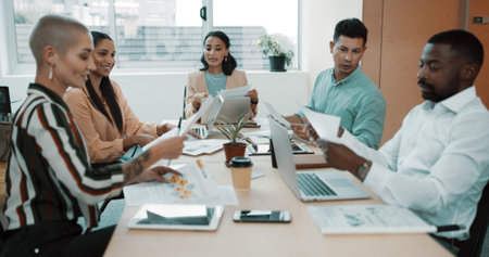 Business people, discussion and document with laptop for planning, delegation or brainstorming at...
