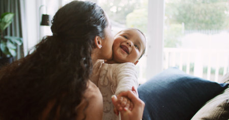 Kiss, playing and mom with baby in home for bonding, loving relationship and child development....