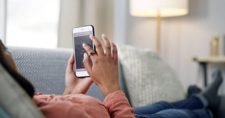 Woman, hands and research with phone screen on sofa for fitness website or health app in home....