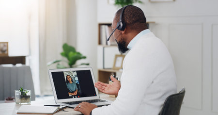 Man, therapist and video call with laptop screen for counseling or online therapy in home. Male...