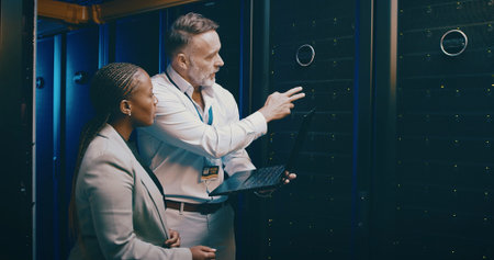 Laptop, team or people in datacenter for planning, backup or IT training with intern. Collaboration,...