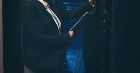 Technician, hands and woman with tablet in server room to install software, system backup or update....