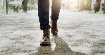 Shoes, businessman and walk on road for travel, morning commute and journey with flare. Outdoor,...