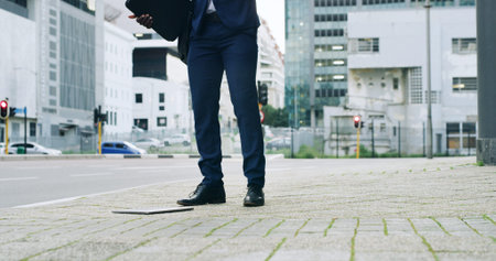Feet, business and person with shoes in city for travel, drop laptop and worker accident. Man, legs...