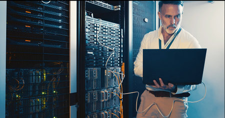 Server room, programmer and man with laptop, tech upgrade and hardware problem solving. IT...