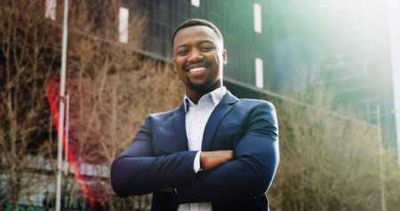 Arms crossed, city and portrait of business black man outdoor for building or property development....