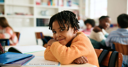Portrait, smile and boy in classroom for learning education, daycare or nursery with students....