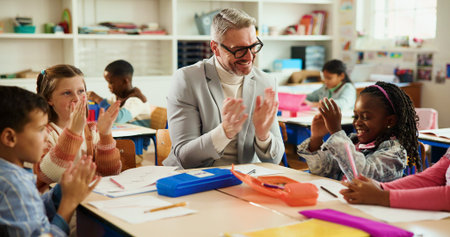 Applause, happy and teacher with kids in classroom for learning, support and assessment group....