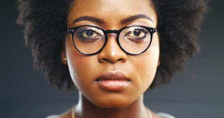 Glasses, portrait and vision with black woman in studio for fitting of prescription frame lenses....
