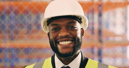 Black man, engineer and smile in portrait at construction site with pride, helmet or real estate...