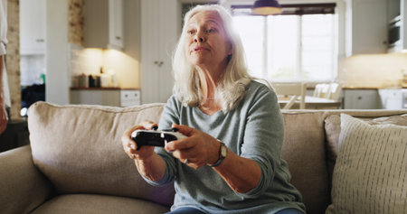 Elderly, woman and gaming with console controller for video games or online entertainment in home....