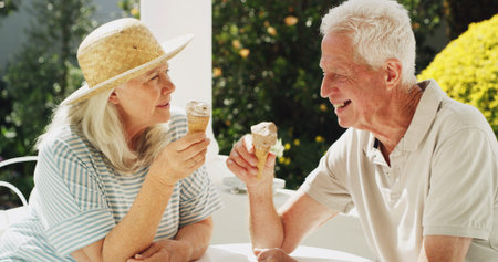 Happy, elderly couple or laughing with ice cream in garden for cool summer snack or bonding. Senior...