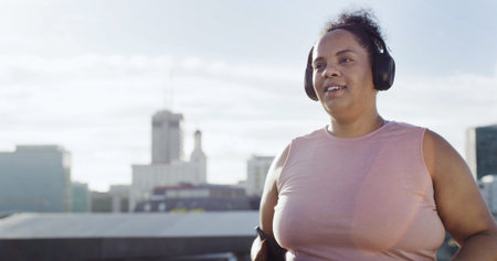 Woman, city and running with headphones for fitness, space for wellness with radio and cardio health...