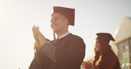 Applause, education and graduation with students outdoor for celebration, milestone or success....
