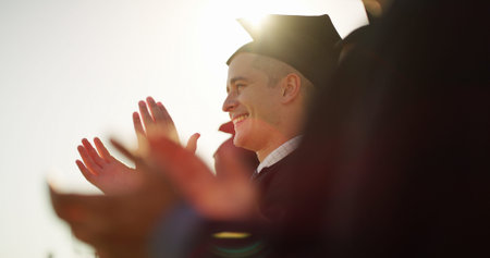 Man, applause and students with celebration, graduation or achievement with congratulations. People,...
