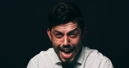 Businessman, crying and scream with depression in studio, financial crisis and space on black...