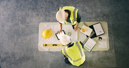 Above, engineer and people with tablet for collaboration, building design and floor plan. Architect...