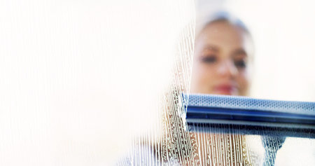 Hygiene, woman and cleaning window with squeegee for chores, maintenance and housework. Glass,...