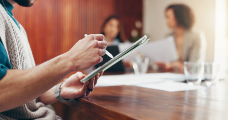 Meeting, tablet and hands of business man in office for planning, project research or digital notes. Startup, creative team and person on tech with stylus for online proposal, web review and feedbackの写真素材