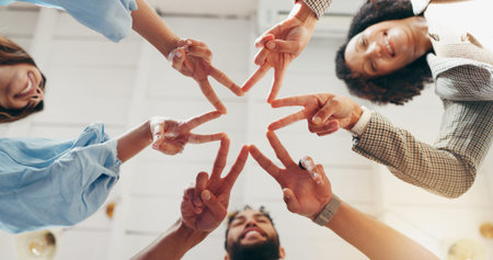 Hands, star fingers and team at office with low angle, support or synergy in circle at startup....