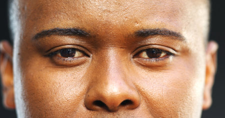 Serious, man or portrait with eyes in studio for eyesight, vision or optometry on a dark background....