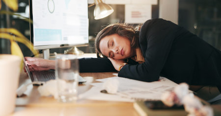 Sleeping, night and business woman at desk for working late, overtime and burnout for deadline....