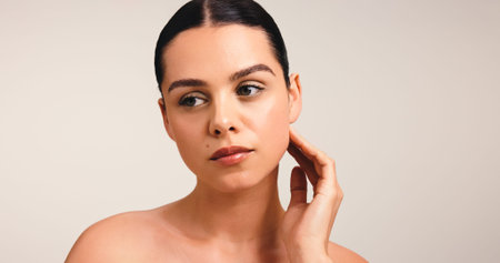 Hand, beauty and vision with woman in studio for self care, reflection and skincare glow....