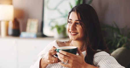 Relax, coffee and woman on couch with smile, inspiration and daydreaming in home. House, morning and...